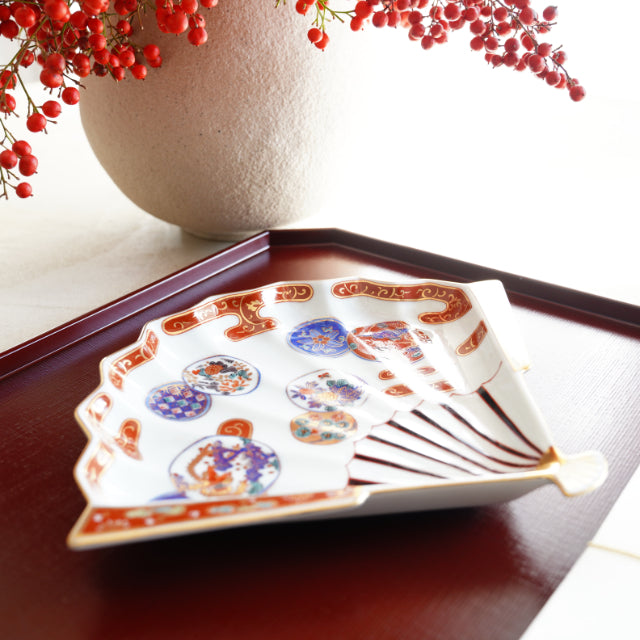 HASAMI WARE RED-OVERGLAZE FAN-SHAPED PLATE WITH PHOENIX DESIGN