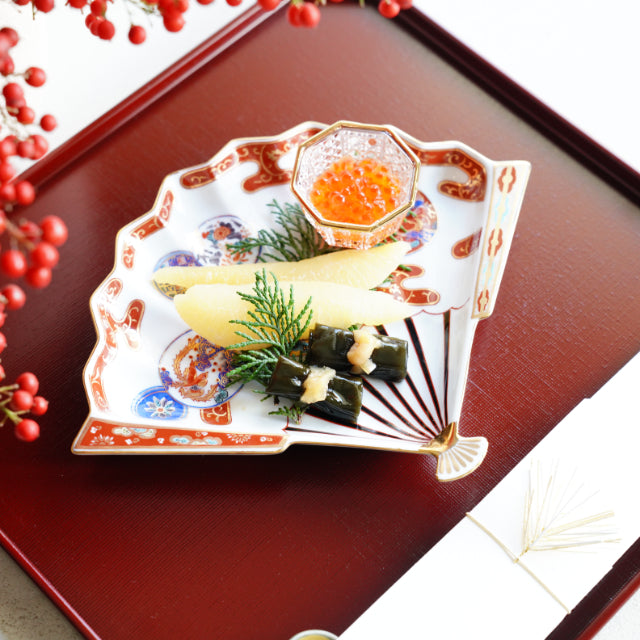 HASAMI WARE RED-OVERGLAZE FAN-SHAPED PLATE WITH PHOENIX DESIGN