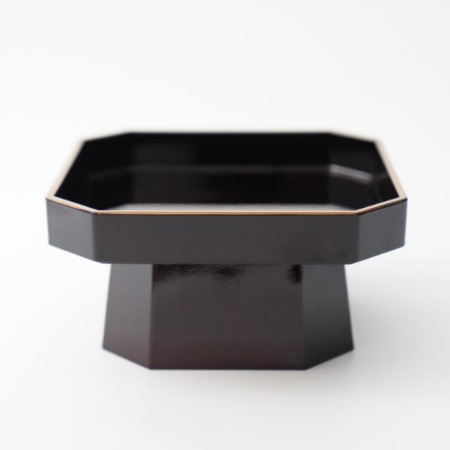 Tame-black sanpo-style serving stand with gold rim