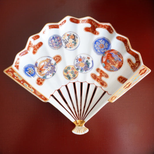 HASAMI WARE RED-OVERGLAZE FAN-SHAPED PLATE WITH PHOENIX DESIGN